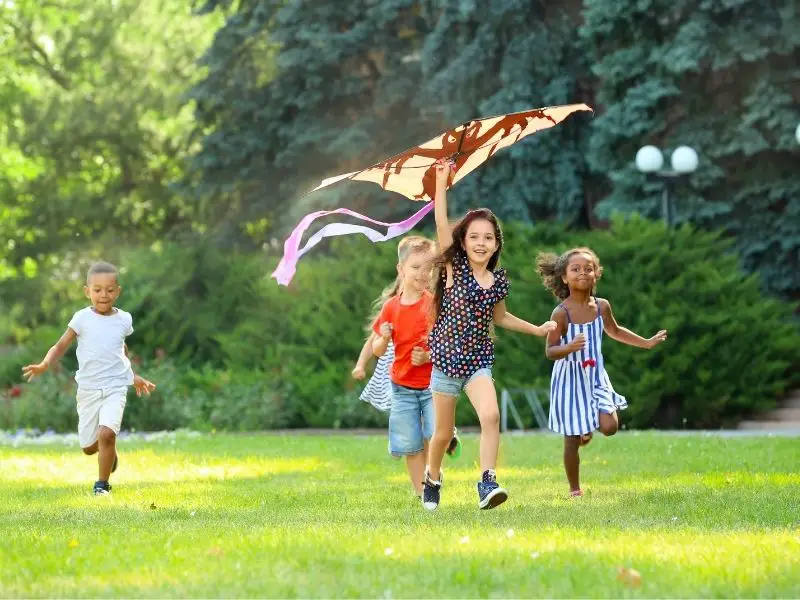Group of children flying a kite